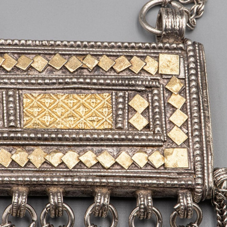 Detail of geometric gold plaque on Omani Hirz amulet